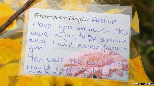 A floral tribute to Arthur Cave from his twin brother with a message