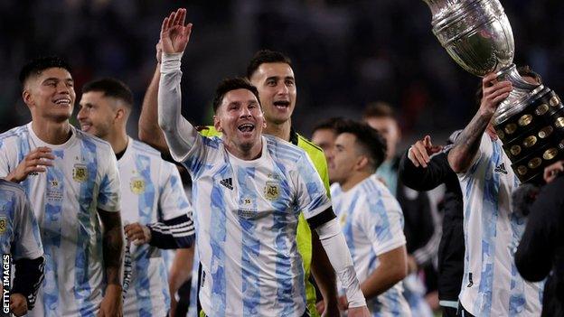 Lionel Messi and other Argentina players celebrate with the Copa America trophy