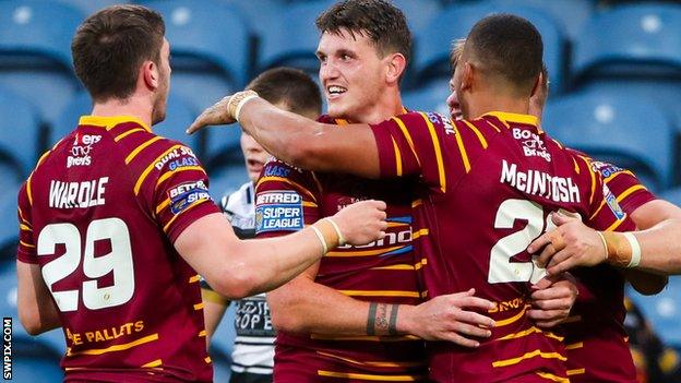 Huddersfield Giants celebrate a try by Darnell McIntosh