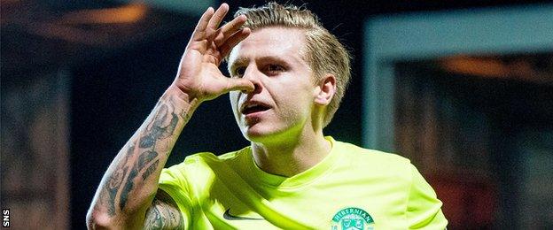 Jason Cummings celebrates scoring Hibs' winner at Dundee United in March