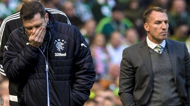 Rangers' Graeme Murty looks shellshocked as Brendan Rodgers looks on during Celtic's 5-0 win