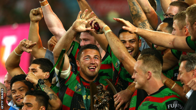 Sam Burgess celebrates winning the 2014 World Cup with his Souths team-mates