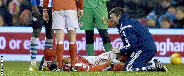 Nottingham Forest's Britt Assombalonga on the ground after dislocating his kneecap against Wigan in February 2015