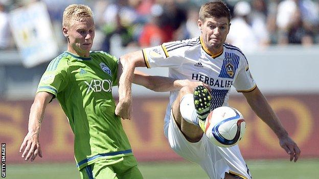 Andy Rose (left) challenges LA Galaxy's Steven Gerrard