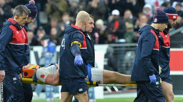 England captain Dylan Hartley is taken from the field on a stretcher