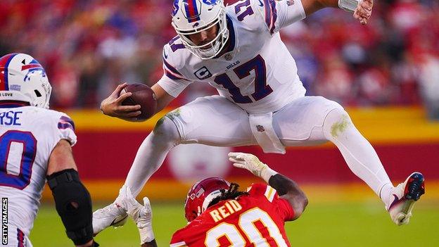 Josh Allen jumps over a Chiefs defender