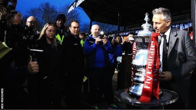 Gary Lineker poses with the FA Cup