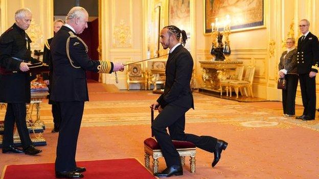 Lewis Hamilton received his knighthood from Prince Charles at Windsor Castle