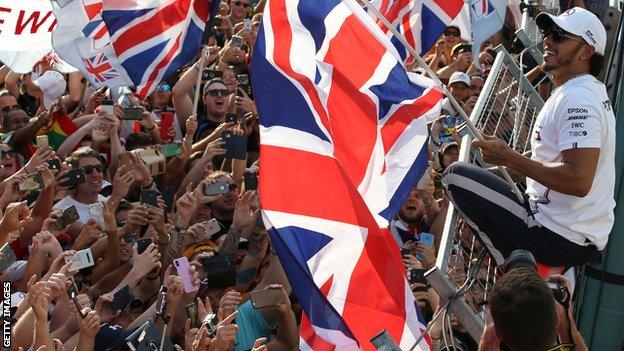 Lewis Hamilton celebrates with fans after winning the Hungarian Grand Prix