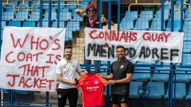 Connah's Quay presented their blood shirt - an extra one in the kitbag in case an players bleed on their own shirt - to Mike Edgeworth