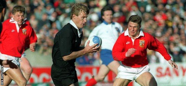 New Zealand wing John Kirwan takes on Lions centre Scott Gibbs