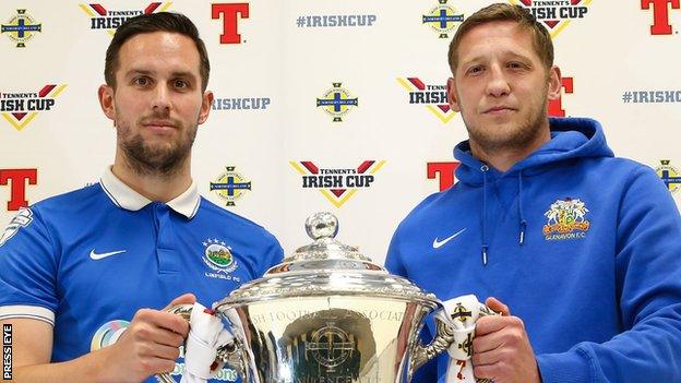 Linfield captain Andrew Waterworth with Kris Lindsay of Glenavon