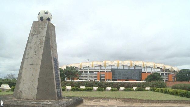 A monument to the people who died in the 1993 crash and the National Heroes Stadium