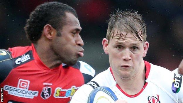 Oyonnax's Uwa Tawalo moves in to challenge Ulster winger Craig Gilroy