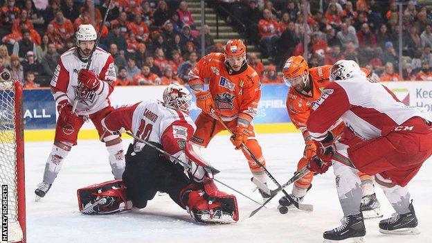 Mac Carruth makes one of his 44 saves in the game