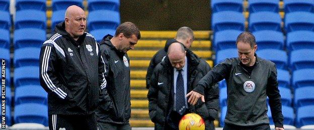 Cardiff City manager Russell Slade and match officials before kick-off