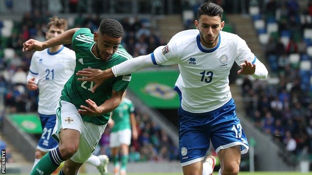 Northern Ireland's Brodie Spencer in action against Nikolas Panayiotou during the 2-2 Nations League draw against Cyprus in Belfast