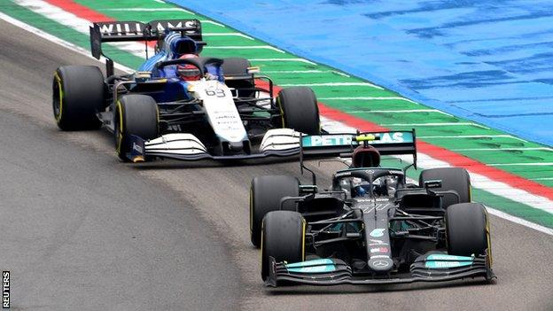 George Russell drives behind Valtteri Bottas