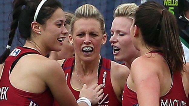 Helen Richardson-Walsh of England is congratulated by her team-mates