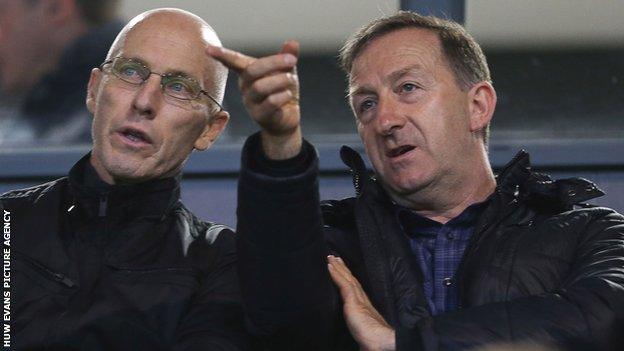 New Swansea City manager Bob Bradley with club chairman Huw Jenkins at an under-23 match