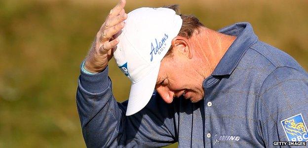 Ernie Els reacts after a bad putt on the first hole during the first round of the 2014 Alfred Dunhill Links Championship at the Championship Links