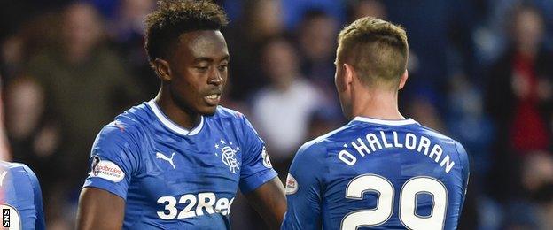 Joe Dodoo and Michael O'Halloran in action for Rangers