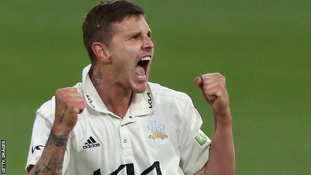 Conor McKerr celebrates a wicket