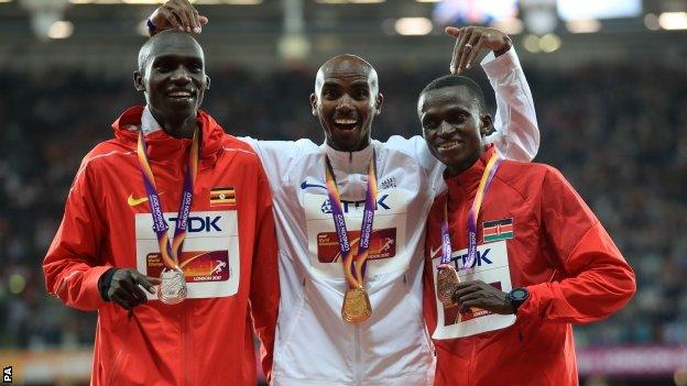 Farah received his medal shortly after edging out Cheptegei (left) by less than a second, with Tanui third