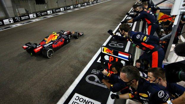 Red Bull pit crew celebrate Max Verstappen's victory at the Aby Dhabi Grand Prix