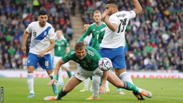 Dan Ballard gets down low to head clear in last week's defeat by Greece at Windsor Park