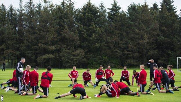 Aberdeen's players - pictured last season - have now returned to training