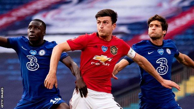 Harry Maguire of Manchester United (centre) battles with Kurt Zouma (left) and Marcos Alonso (right) of Chelsea