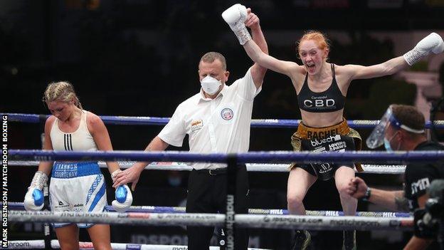 Rachel Ball (right) jumps in the air in celebration after being declared winner over Shannon Courtenay (left)