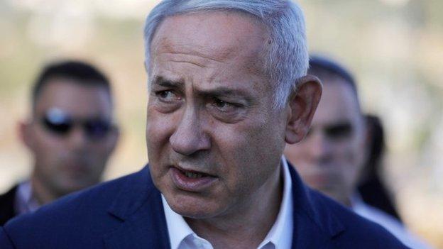 Israel's Prime Minister Benjamin Netanyahu speaks to the press at the site where an off-duty Israeli soldier was found dead