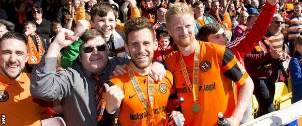 Dundee United scorers Tony Andreu and Thomas Mikkelsen celebrate with fans