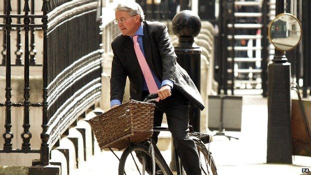 Andrew Mitchell cycles into Downing Street in May 2011