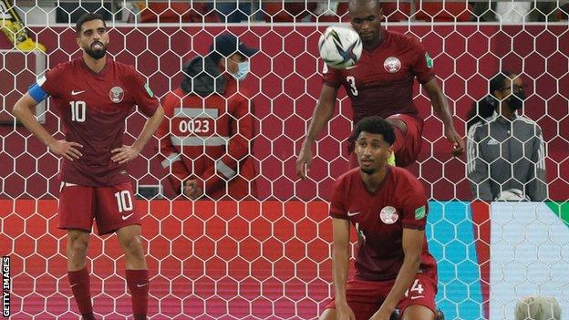 Qatar players react to Algeria's late winner