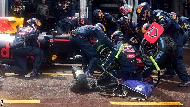 Red Bull work on Daniel Ricciardo's car during the Monaco GP