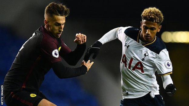 Charlie Oliver competes for the ball with Marcus Edwards