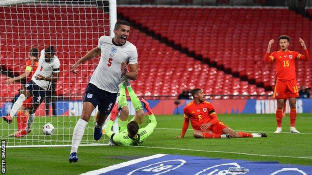 Conor Coady celebrates after scoring for England