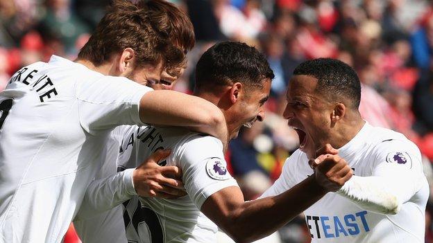 Kyle Naughton (centre) celebrates his goal with team-mates