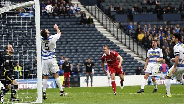 Adam Rooney loops in the opening goal for Aberdeen at Hampden