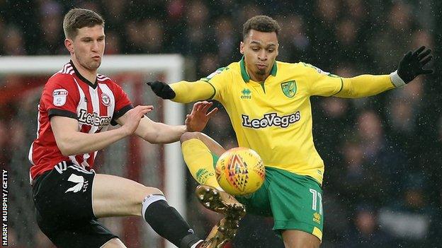 Chris Mepham of Brentford and Josh Murphy of Norwich City