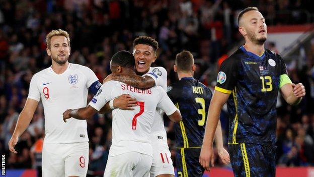 Harry Kane, Raheem Sterling and Jadon Sancho celebrate a goal against Kosovo