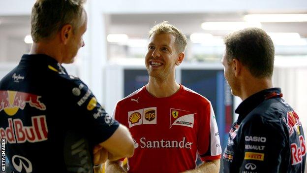 Ferrari driver Sebastian Vettel (centre) speaking to Red Bull chief Christian Horner (right) and team manager Jonathan Wheatley