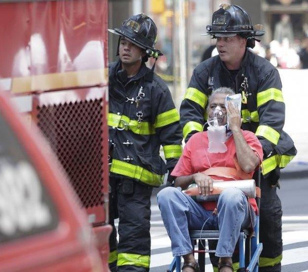 Emergency workers at the scene of the Times Square crash in New York.