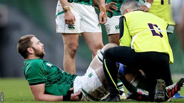 Iain Henderson receives treatment during Ireland's win over Scotland