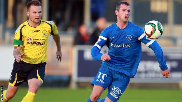 Ballinamallard's Ryan Campbell attempts to burst away from Dungannon's Ryan Harpur at Ferney Park