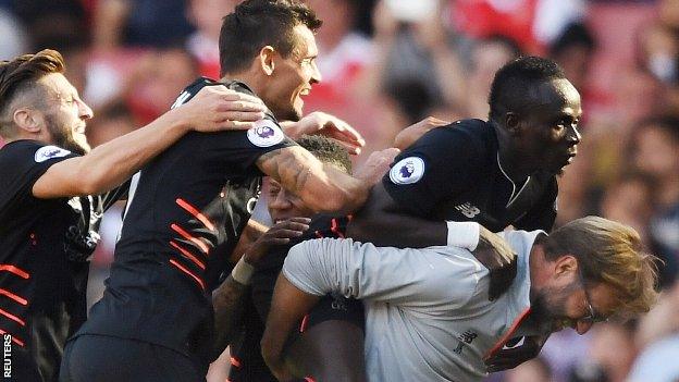 Sadio Mane (right) celebrates scoring against Arsenal