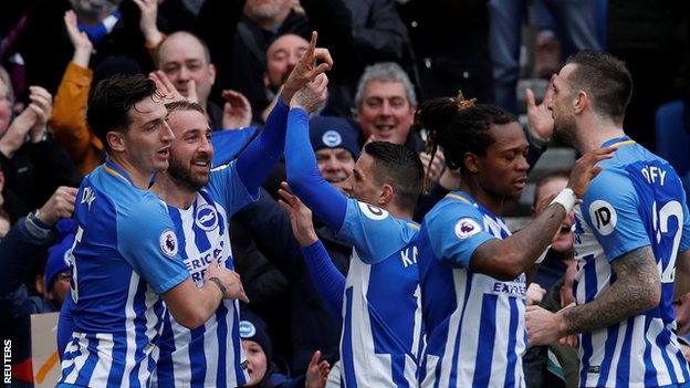 Glenn Murray celebrates scoring with Brighton team-mates